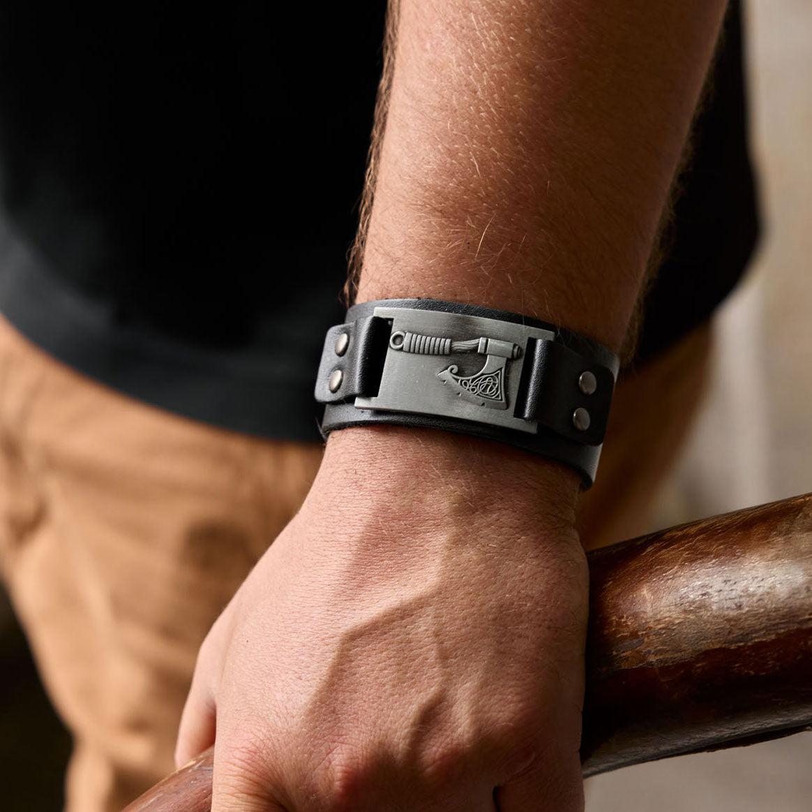 Viking axe bracelet in black leather worn on wrist – Norse warrior style