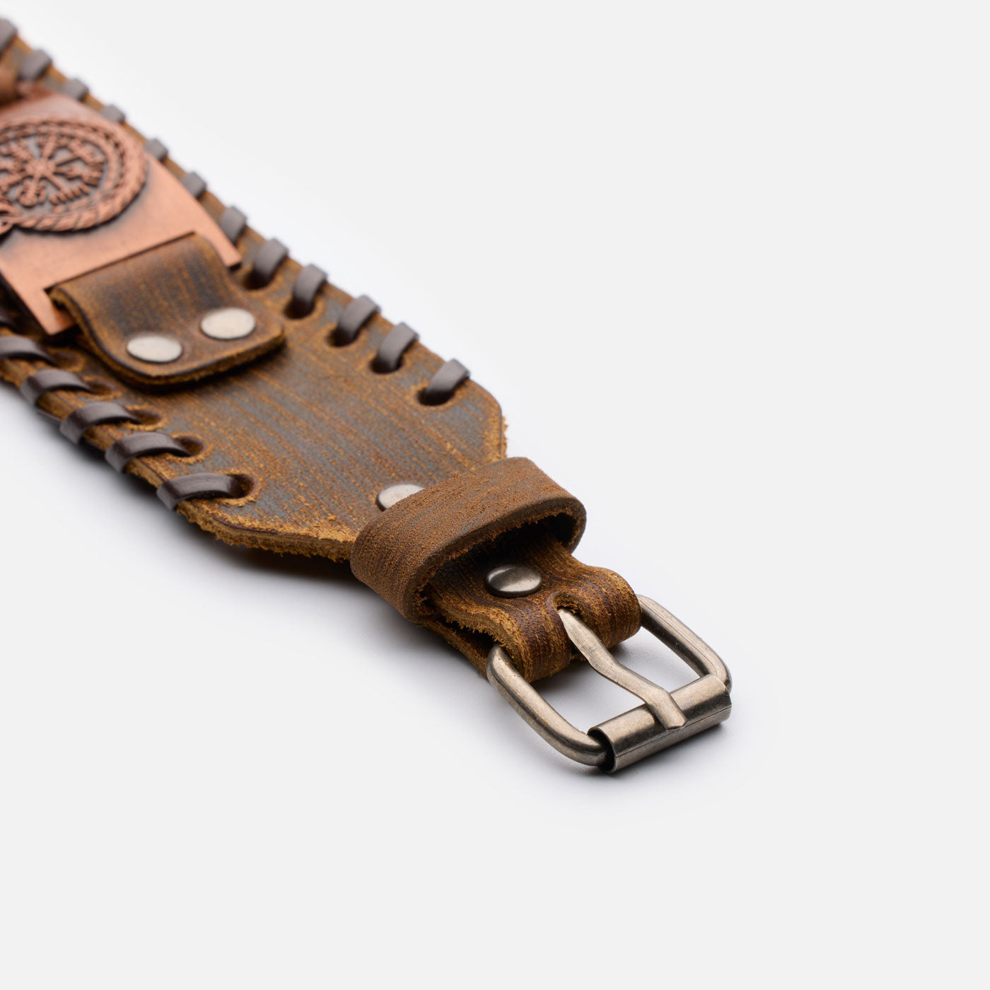 Close-up of antique bronze buckle and leather texture on Jormungandr bracelet – brown version