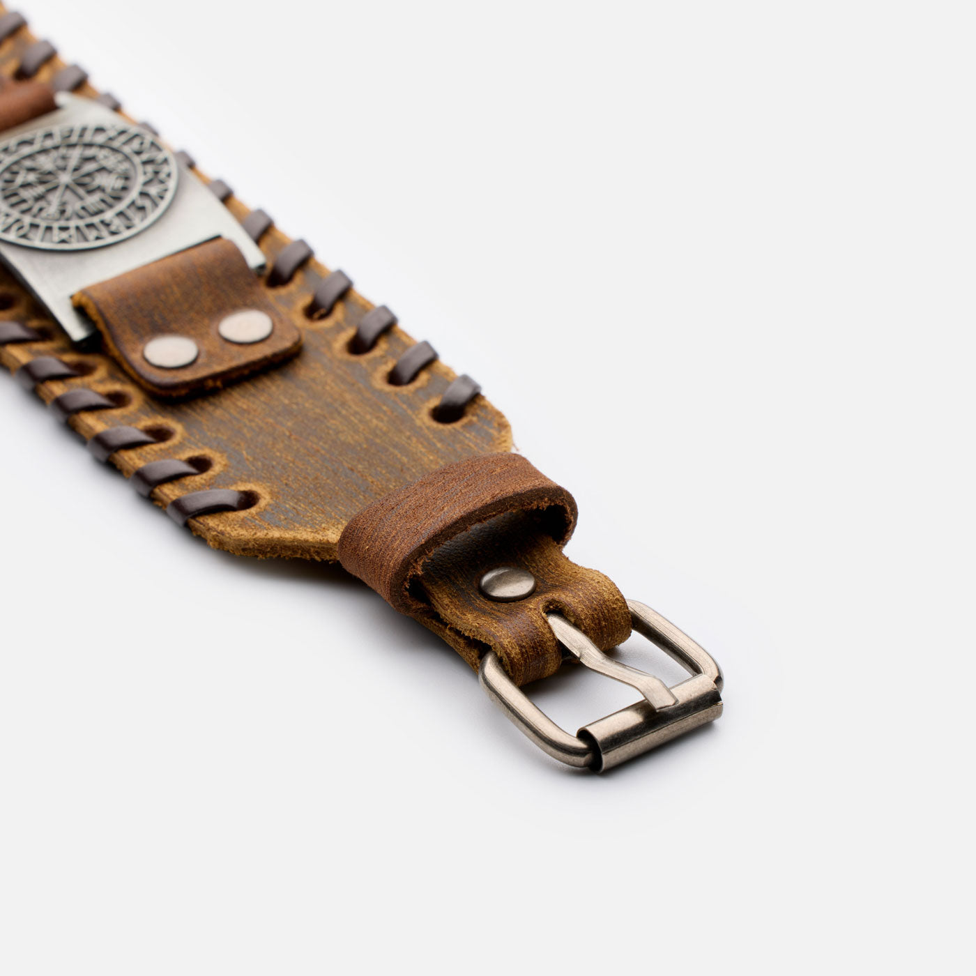 Side view of brown Vegvisir leather bracelet with adjustable buckle and Norse motif