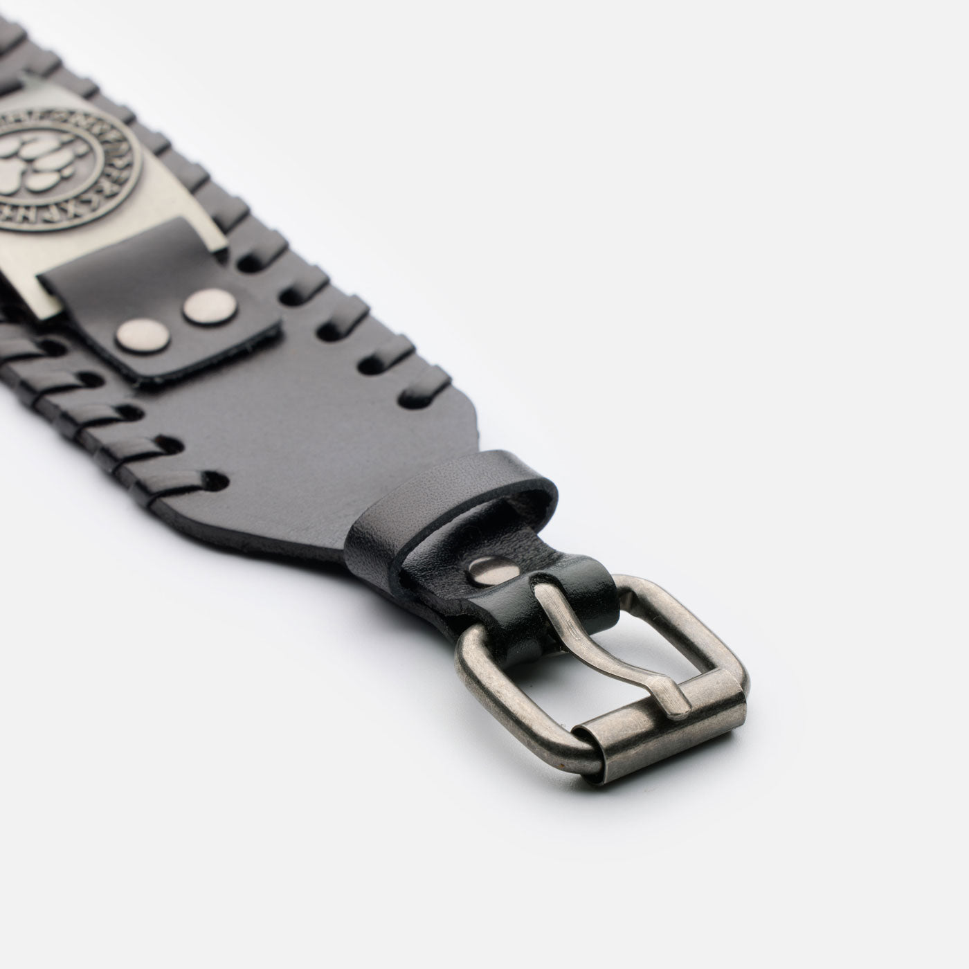 Close-up of adjustable black leather Viking buckle with steel clasp and stitching