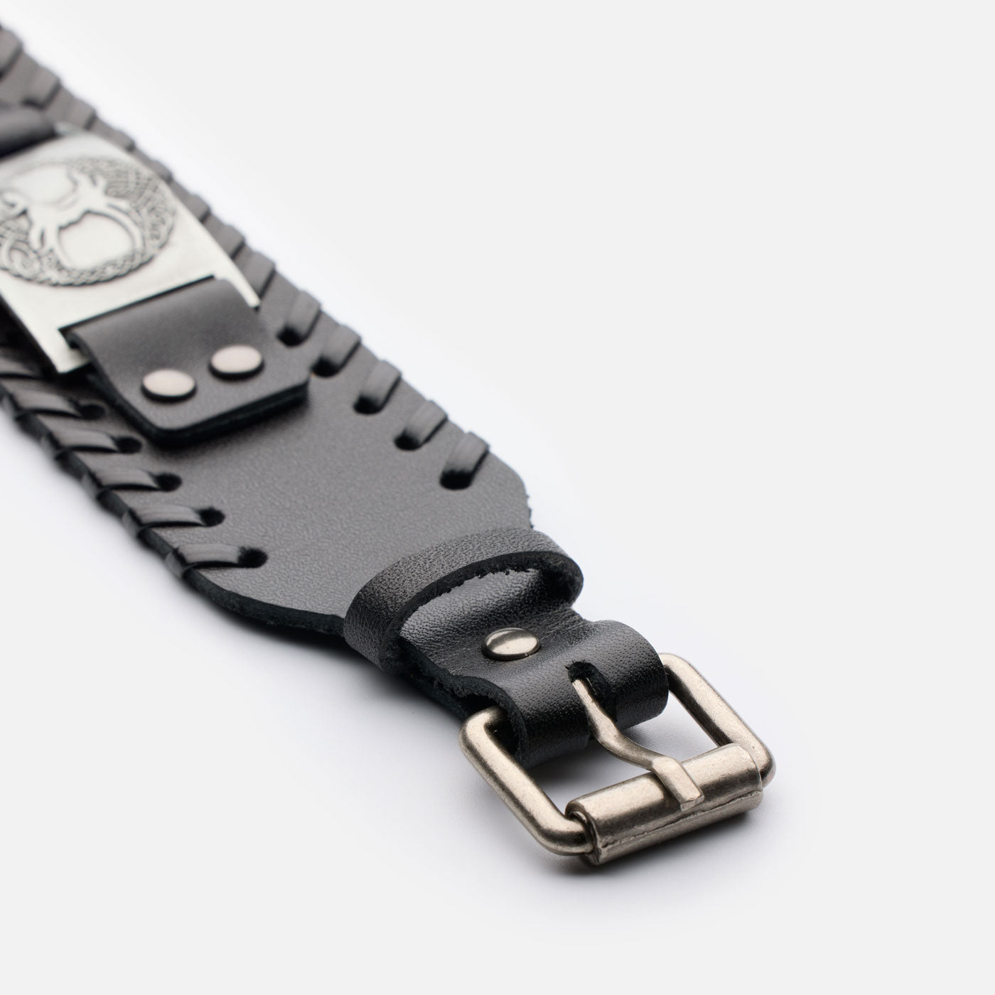 Close-up of the Yggdrasil tree symbol on stainless steel plate – black leather version