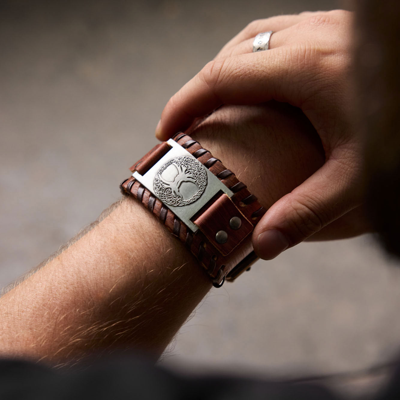 Yggdrasil bracelet in brown leather – Viking-style wristwear on arm