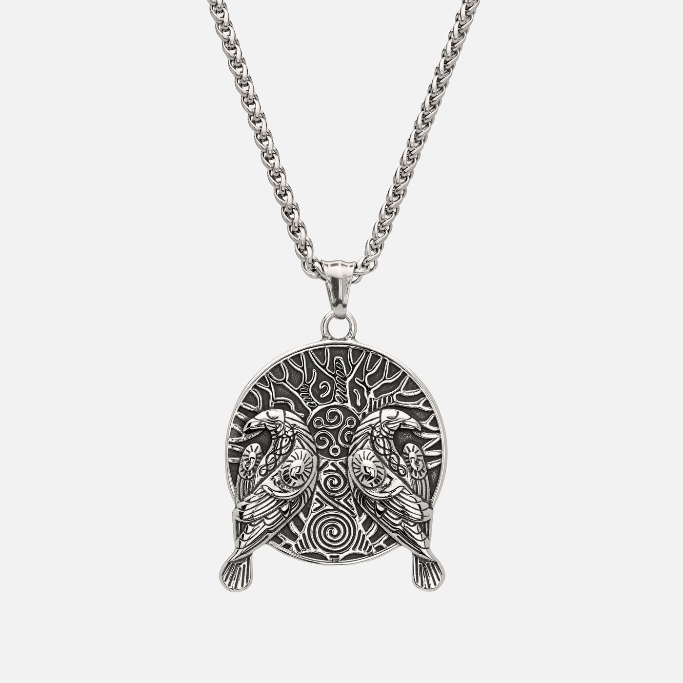 Viking necklace with Hugin and Munin in front of Yggdrasil, symbolizing memory, thought, and cosmic connection.