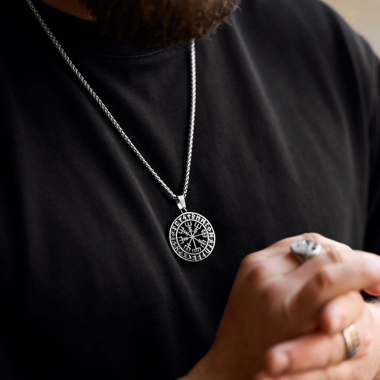 Powerful Vegvisir pendant necklace with Elder Futhark runes, symbolizing guidance and protection, worn confidently as part of an expressive Viking-inspired look – exclusive to Odin Trinkets.