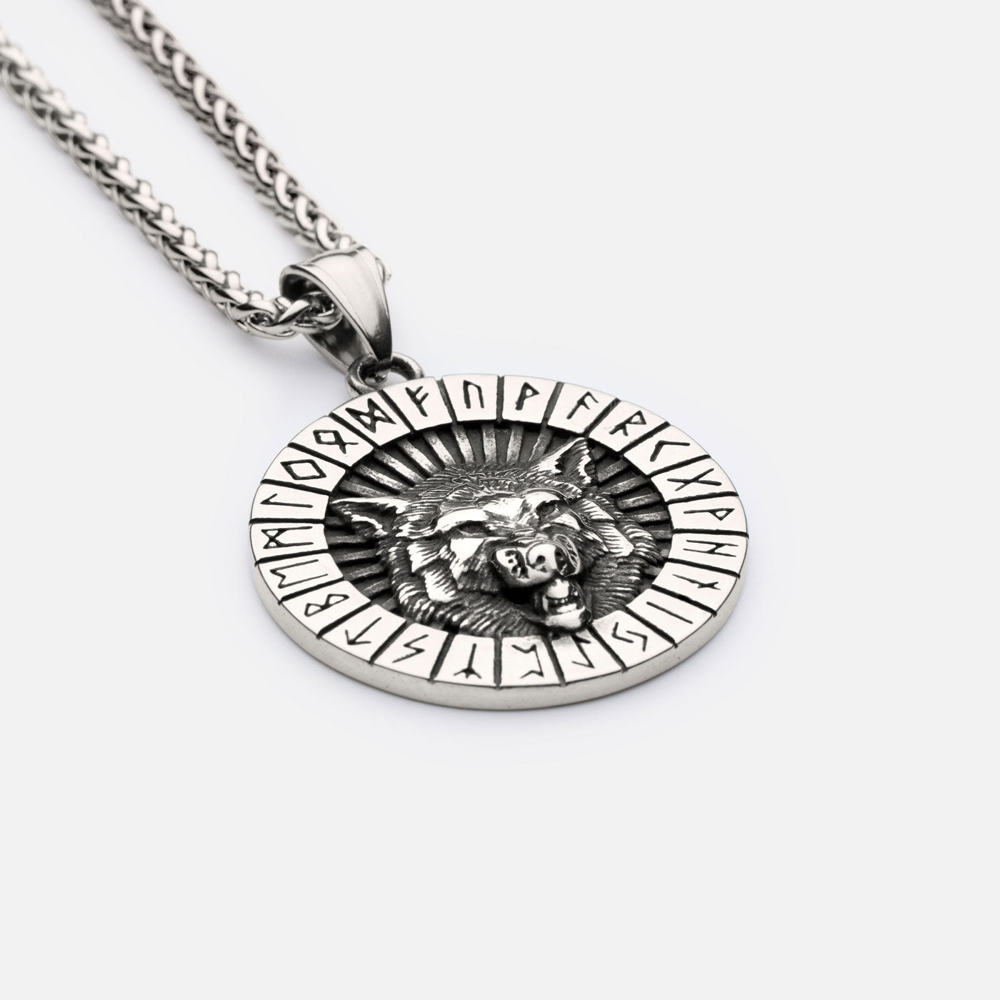 Side angle of Viking wolf pendant with Elder Futhark runes, hanging on a rugged curb chain for a classic Norse warrior look.