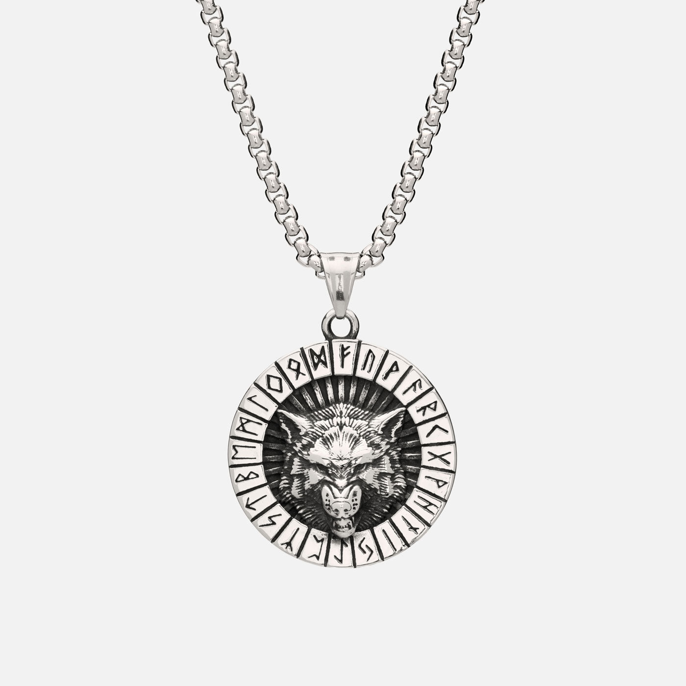 Front view of Norse wolf pendant featuring snarling wolf head and Elder Futhark runes, hanging from box chain necklace.