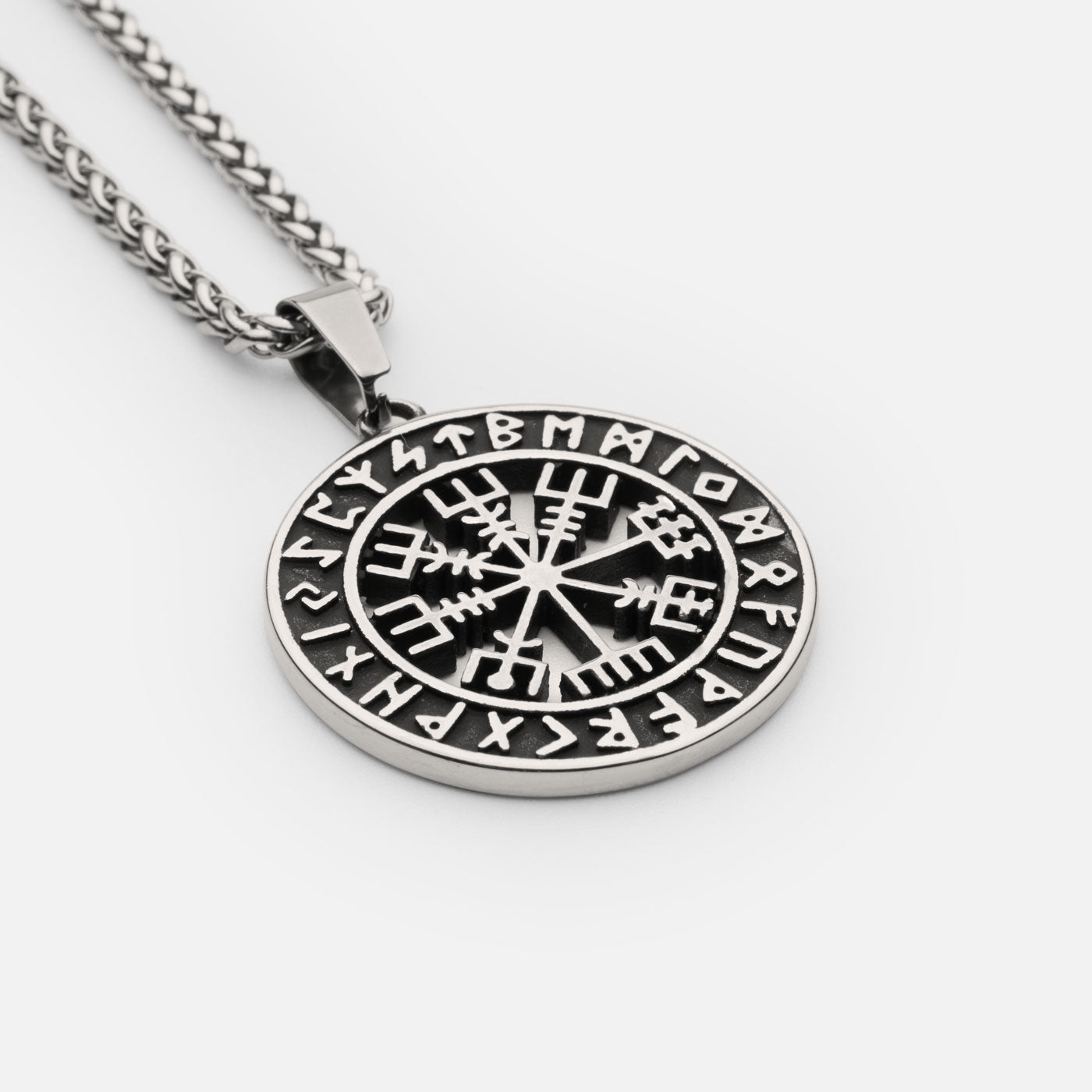 Bold silver Vegvisir pendant necklace with Elder Futhark runes, representing Viking navigation and protection – a striking creation from Odin Trinkets.