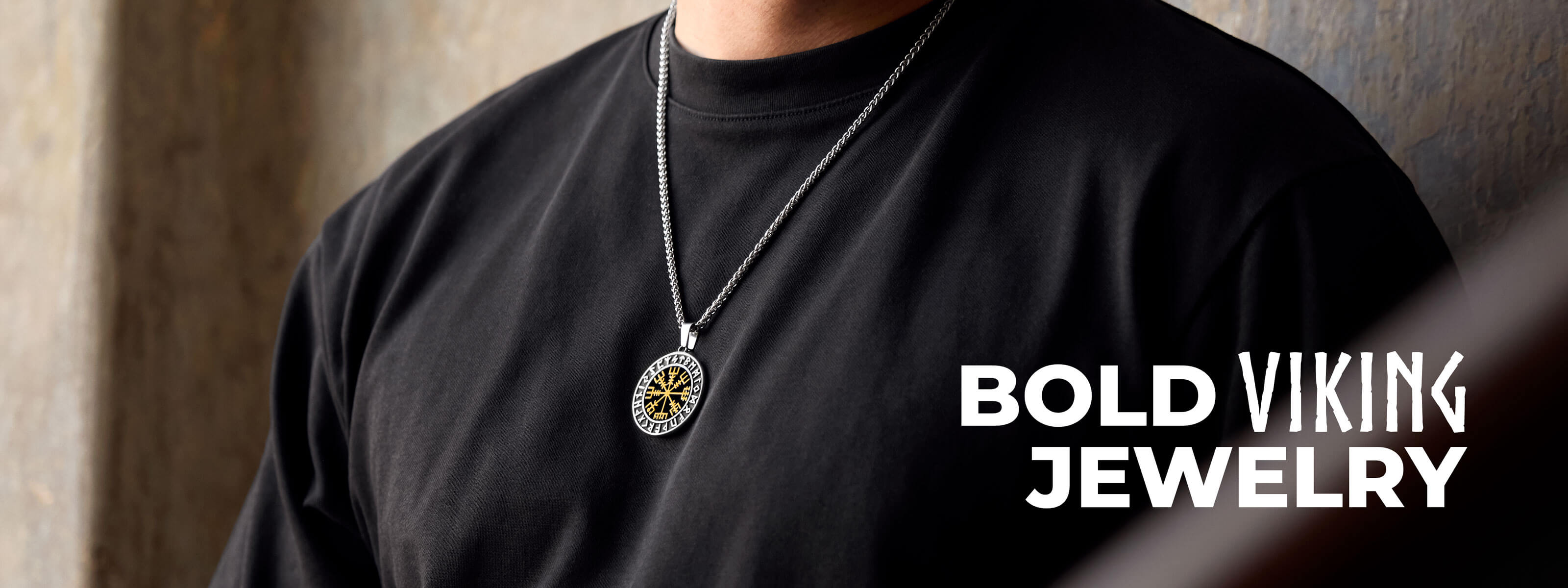 A bold Viking jewelry web banner featuring a person wearing a Vegvisir pendant on a chain, highlighted against a dark background with the text "BOLD VIKING JEWELRY."