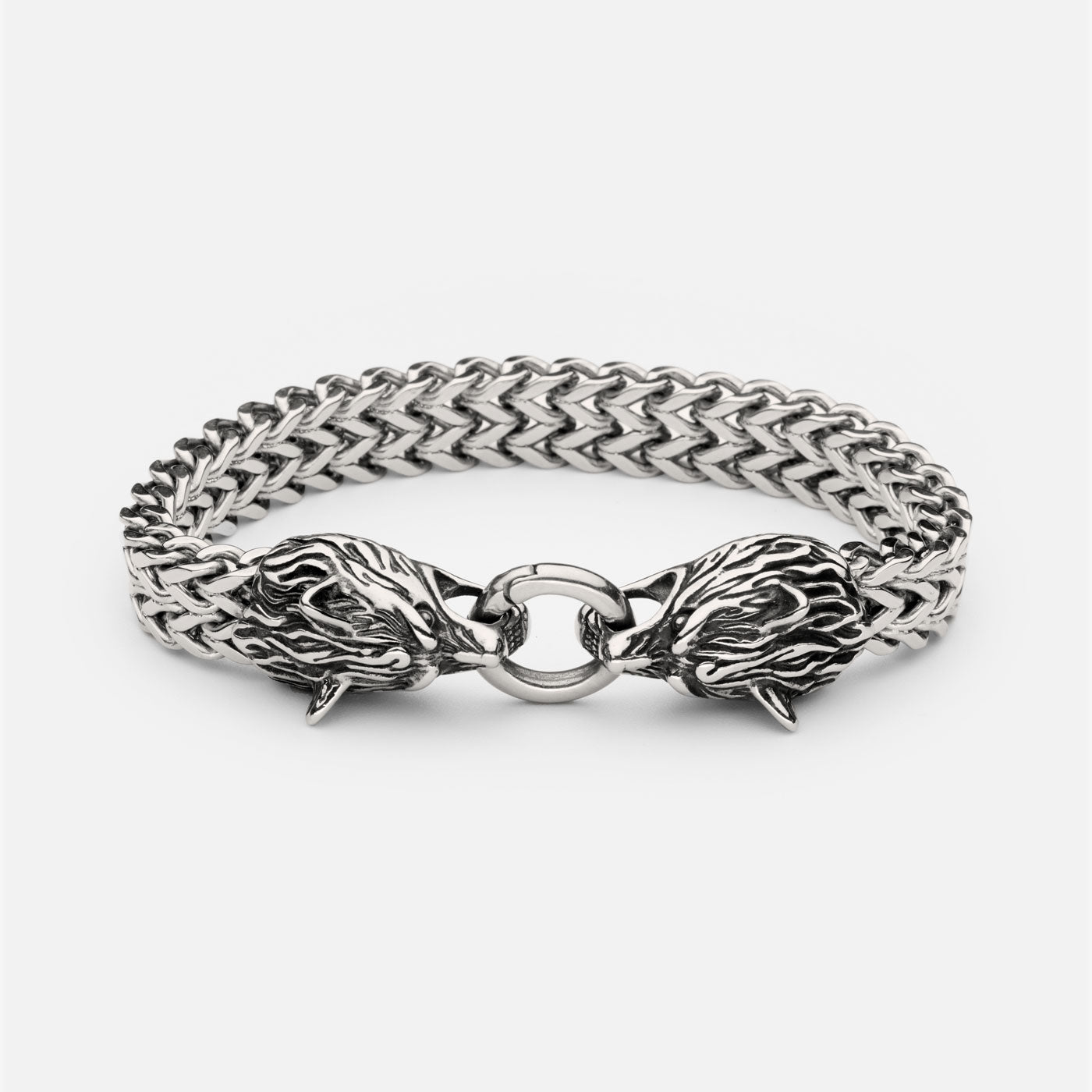 Full view of the stainless steel Geri and Freki wolf bracelet from Odin Trinkets, featuring intricately detailed wolf heads clasping a central ring, symbolizing Odin’s legendary companions.