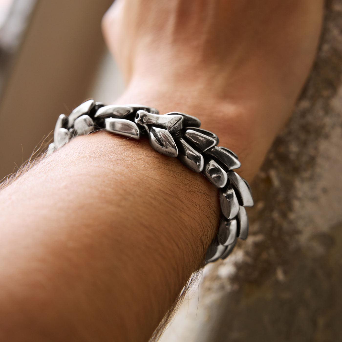 The stainless steel Jörmungandr bracelet from Odin Trinkets worn on a wrist, showcasing its bold serpent-inspired design, symbolizing the legendary Norse World Serpent.