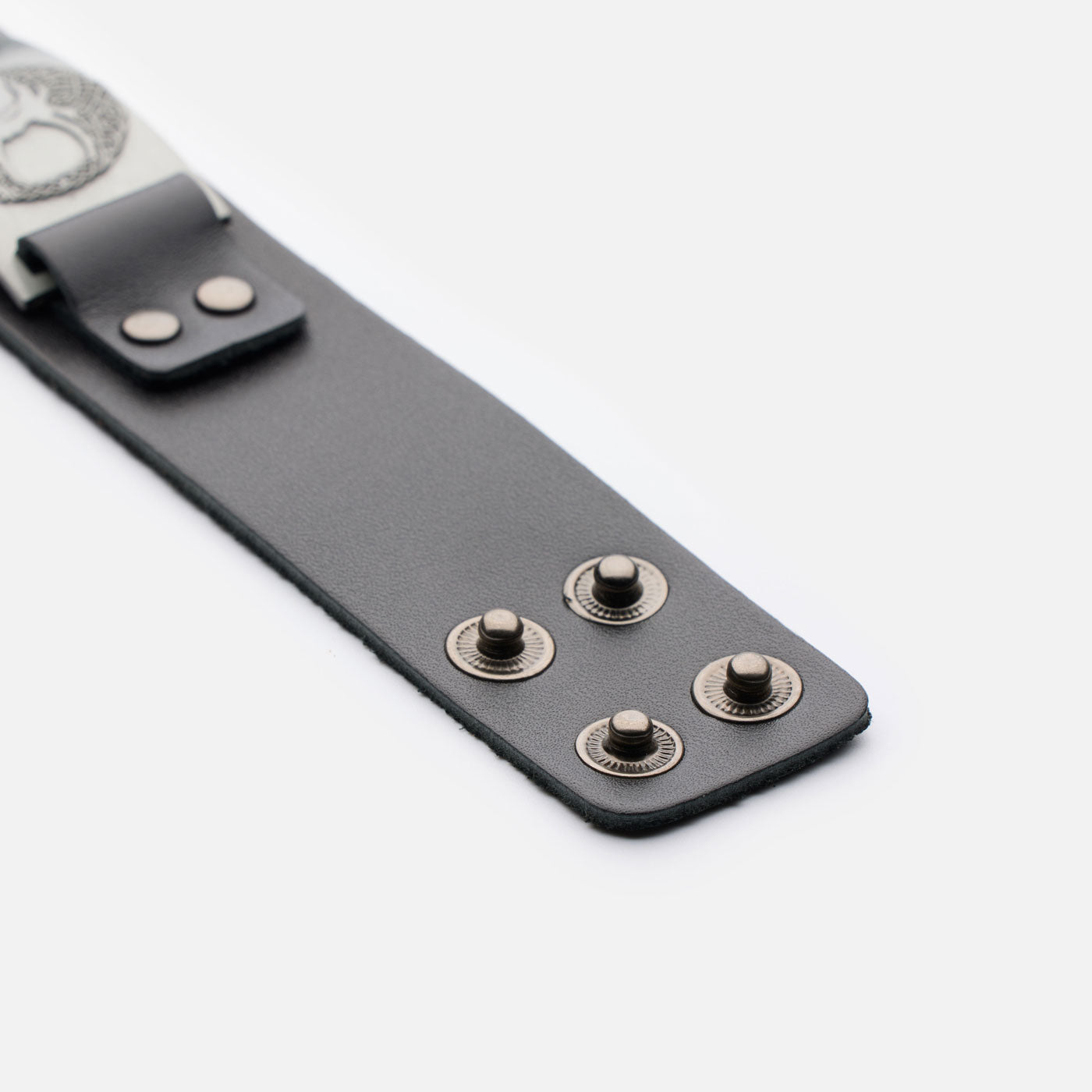 Close-up of open snap fasteners on black Yggdrasil leather bracelet