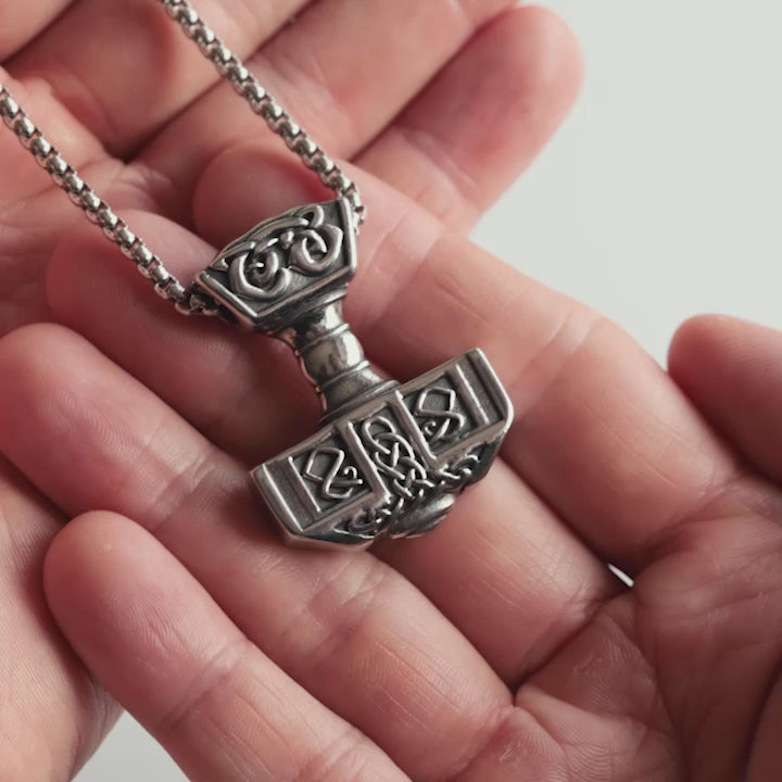 Close-up Video of forged in Midgard Mjölnir necklace with box chain – medium-sized Thor’s Hammer pendant with Norse knotwork.