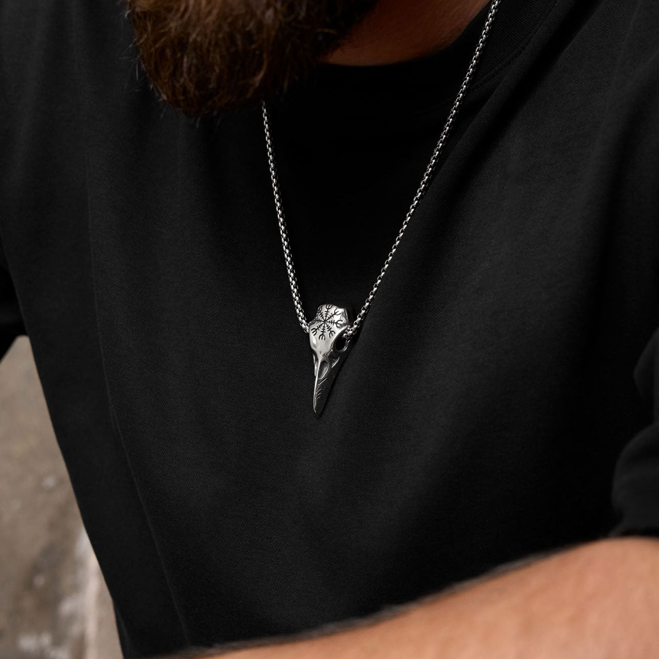 Raven skull necklace with Helm of Awe worn on chest – Viking-style men’s jewelry