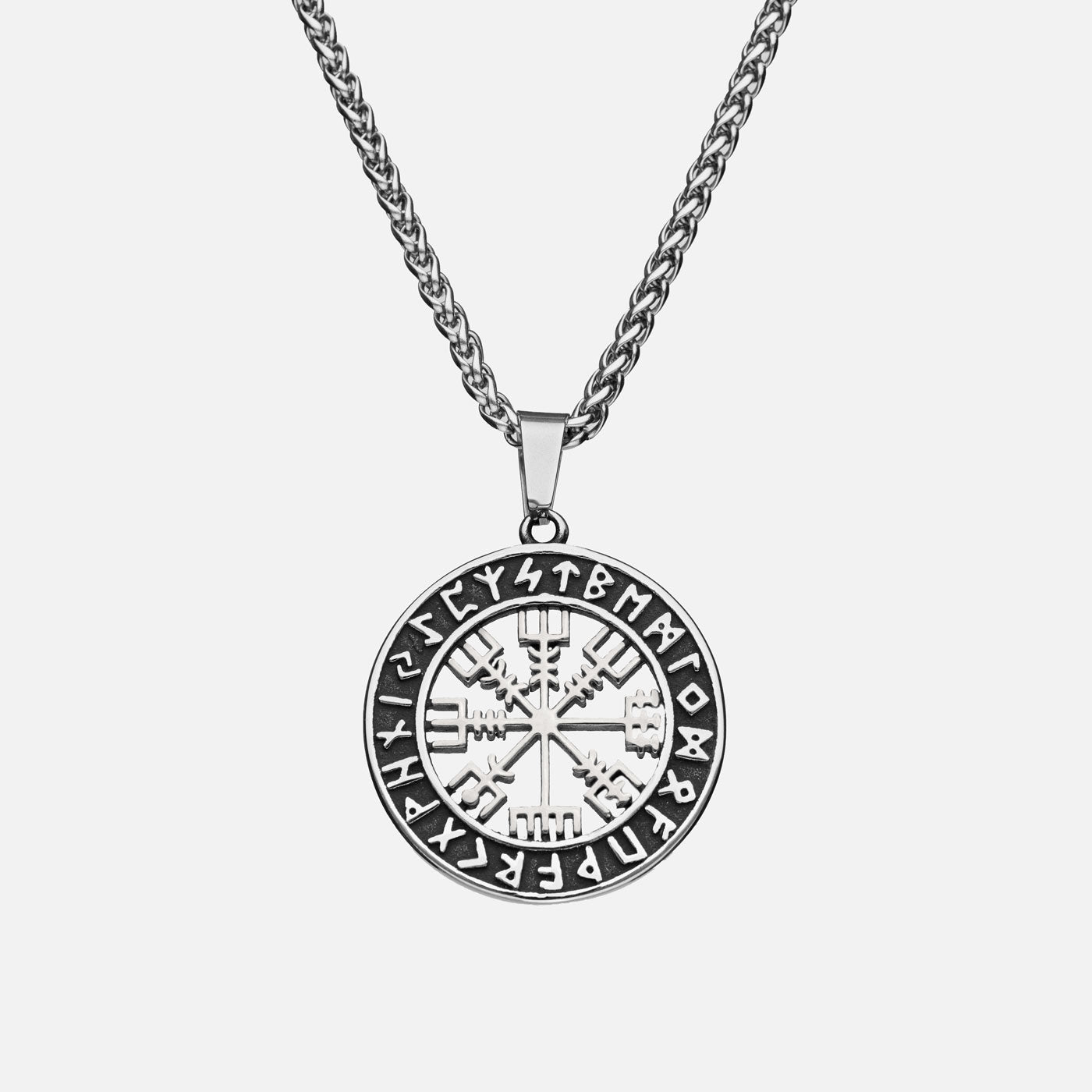 Striking silver Vegvisir pendant necklace with Elder Futhark runes, a powerful Viking talisman for guidance and protection – an expressive piece from Odin Trinkets.