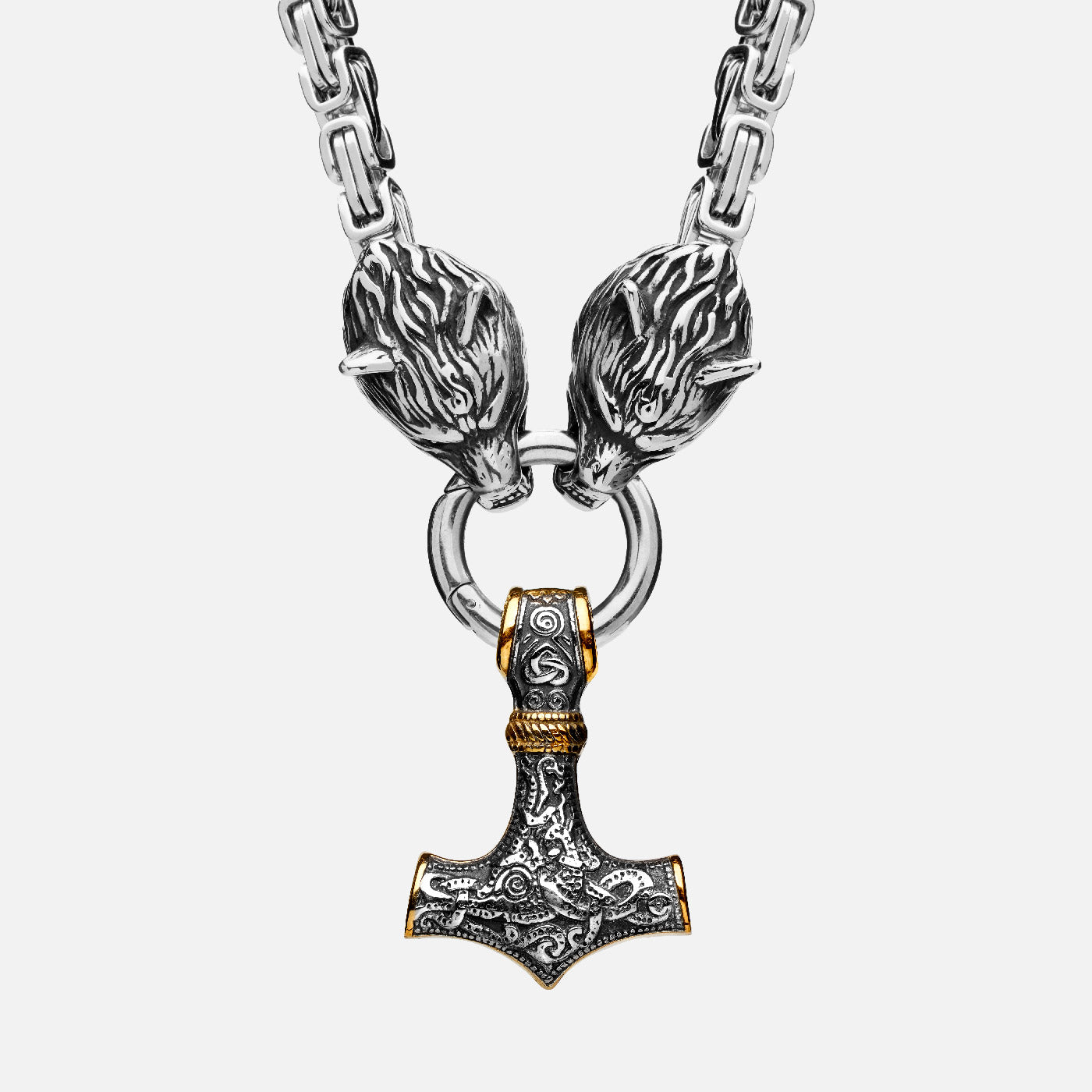 Detailed front view of a Viking necklace featuring a golden Thor's hammer Mjölnir hanging from two wolf heads, attached to a thick keel chain.