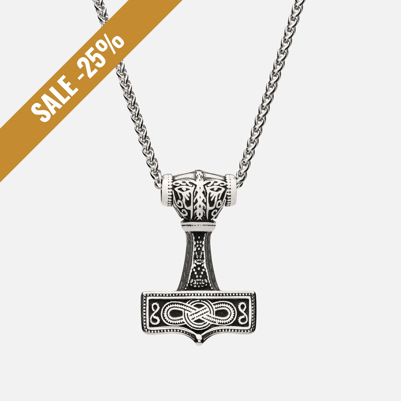 Close-up of the Mjölnir of Asgard pendant showing Norse knotwork in antique silver with a sale banner