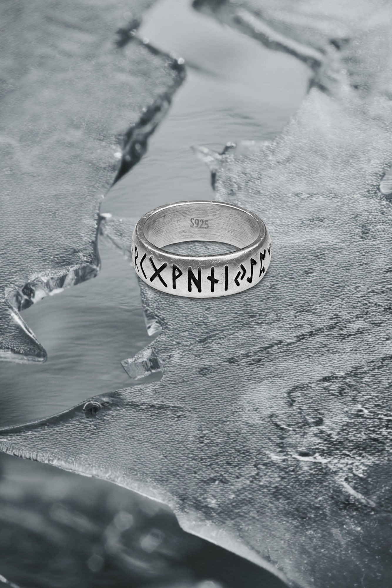 A silver ring engraved with nordic runes and a S925 stemp. Inspired by norse mythology