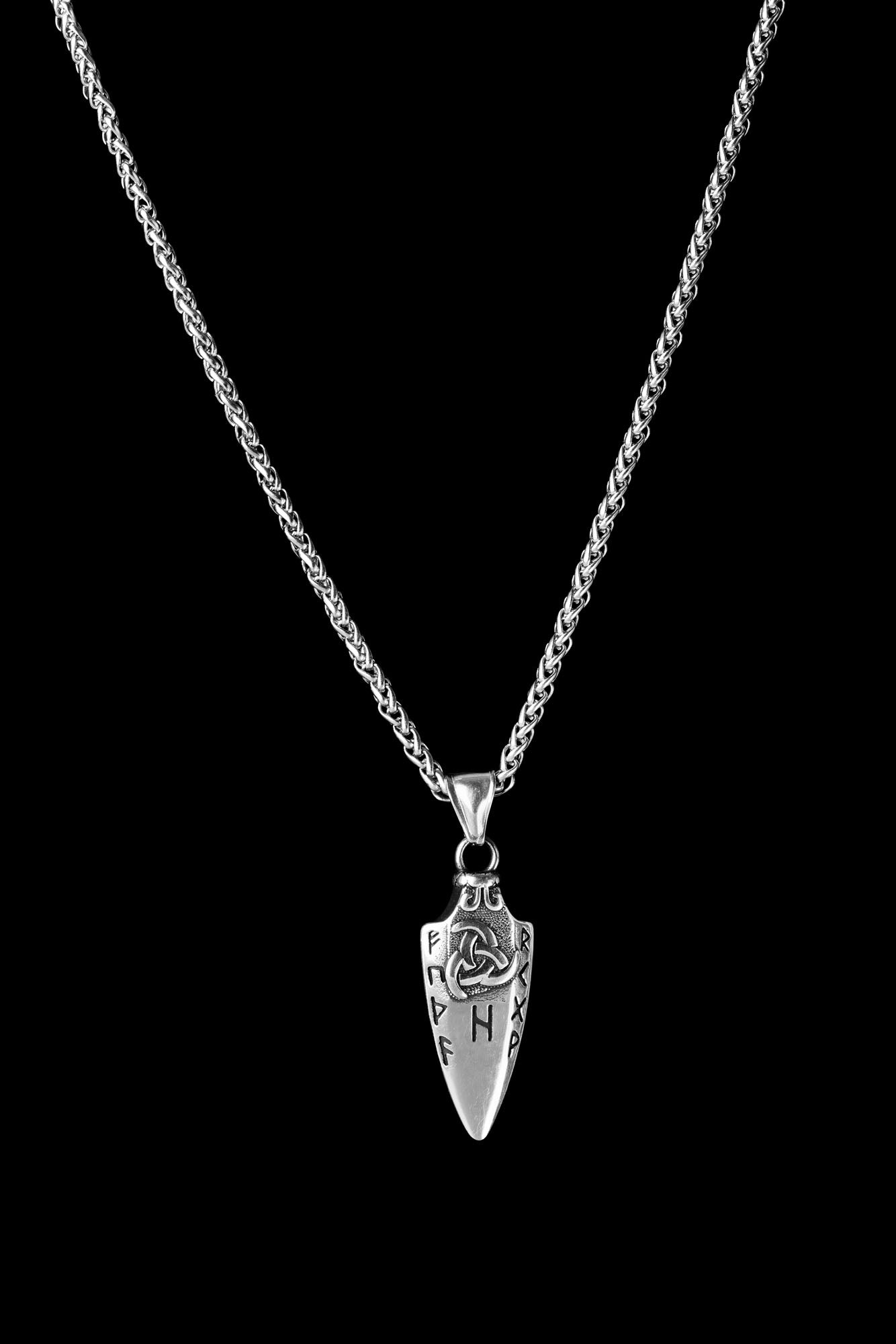 Backside of the Gungnir necklace featuring a spearhead pendant engraved with intricate Nordic runes and a knot design, displayed on a transparent background. Available at Odin Trinkets.