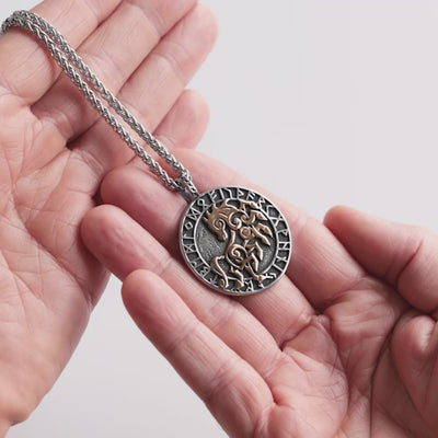 Close-up video of a stainless steel Pendant featuring Sleipnir and elder futhark with golden accents and bold Viking-inspired design. This Norse mythology Necklace symbolizes strength and ferocity, captured in detail to highlight its craftsmanship – a statement piece from Odin Trinkets.