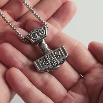 Close-up Video of forged in Midgard Mjölnir necklace with box chain – medium-sized Thor’s Hammer pendant with Norse knotwork.