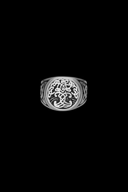 Stainless steel Yggdrasil ring featuring an intricately designed Tree of Life symbol at the center, flanked by knotwork patterns on the sides. The detailed craftsmanship embodies Norse mythology and symbolizes interconnectedness and eternity. Available at Odin Trinkets.